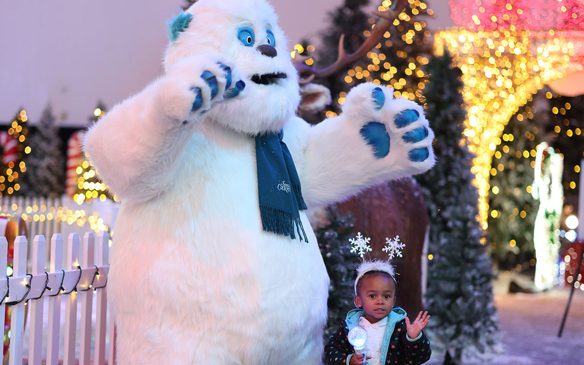 Doll interaction area featuring themed winter entertainment and interactive attractions for children in a snow park.