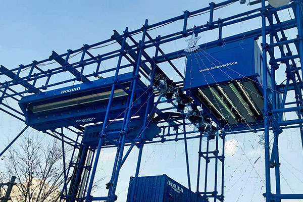Outdoor snow falling machine providing realistic artificial snowfall for snow theme parks, public spaces, and winter entertainment venues.